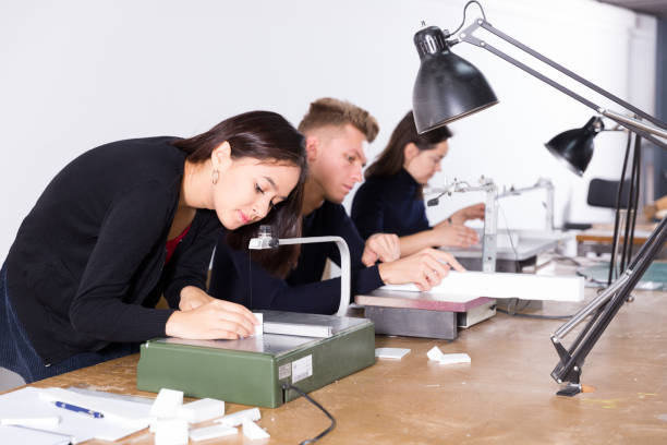 istock Female architect working on fret saw 1081894288