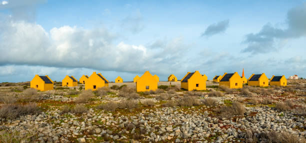 Yellow abandon slave huts near the salt plains on Bonaire.