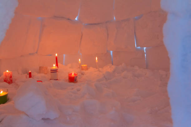 istock Candles illuminate the igloo snow house from inside. 1081894836