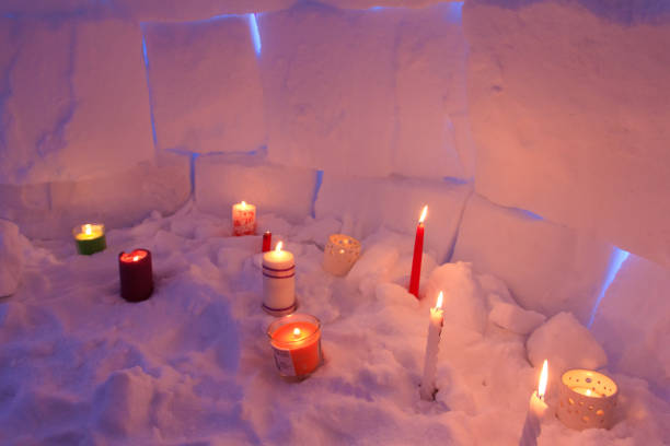 istock Candles illuminate the igloo snow house from inside. 1081894840