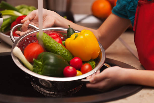 istock Making a healthy salad, washing ingredients - various vegetables, shallow depth 1081895272
