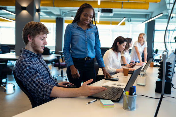 istock Young coworkers in modern office 1081904240