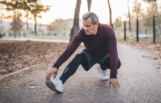 istock Senior man stretching after jogging 1081906220