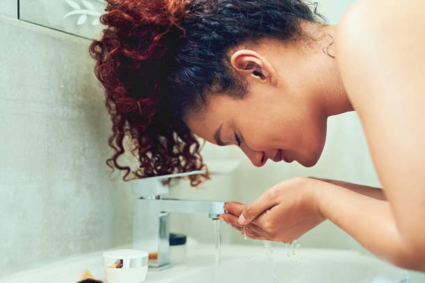 istock I wash my face with water only 1081906464