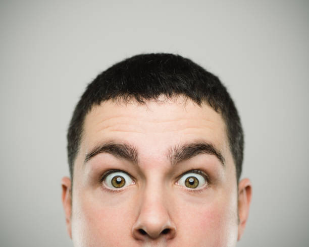 istock Portrait of a surprised young caucassian man looking at camera. 1081907464