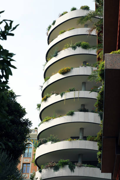 istock Modern Ecologic Skyscrapers With Much Green Plants On Every Balcony 1081912036