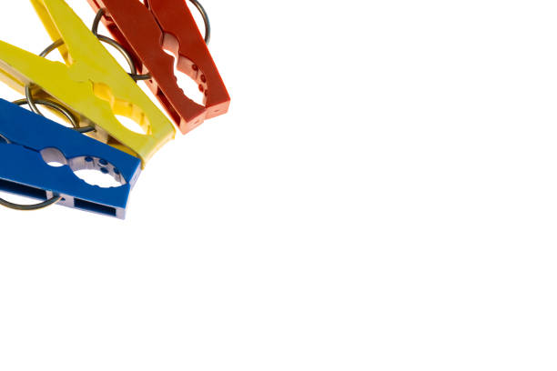 fragment of colored clothespins on white background isolated as frame. dry cleaning, Laundry and linen care. place for text