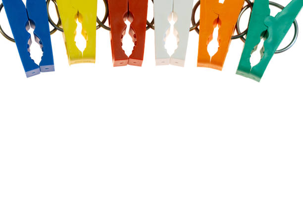 fragment of colored clothespins on white background isolated as frame. dry cleaning, Laundry and linen care. place for text