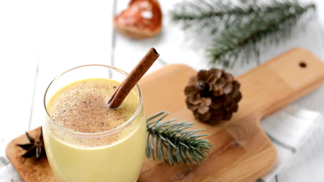 Homemade traditional Christmas eggnog drink in a glass