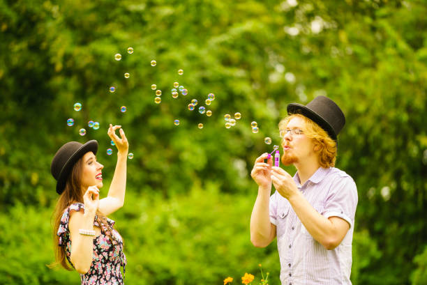 istock Couple blowing bubbles outdoor 1081925046