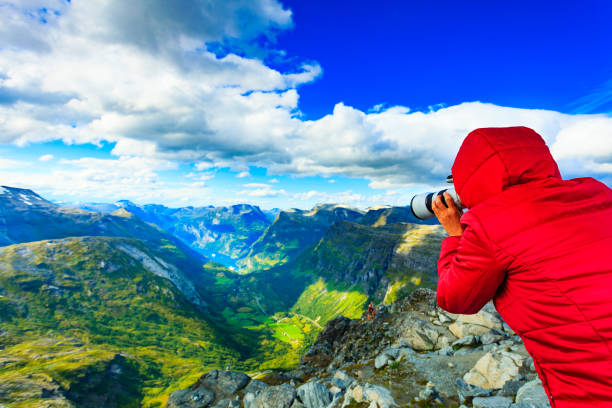 istock Tourist taking photo from Dalsnibba viewpoint Norway 1081925126