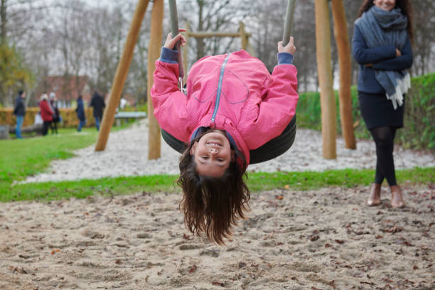 istock Girl on the swing smiling 1081925422