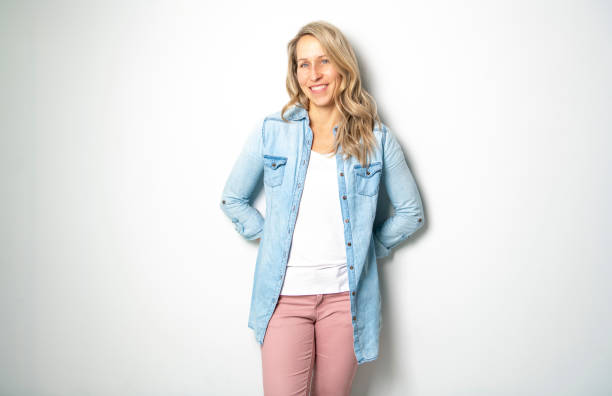 istock Beautiful 30 years old woman smiling on studio white 1081925432