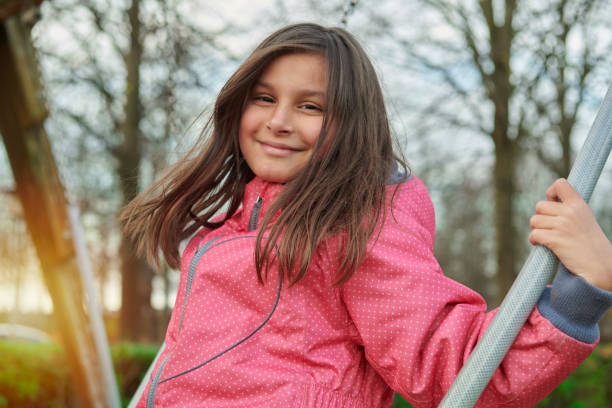 Little girl climbing in playground