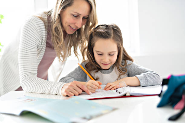 istock A Mother and Child doing homework at home 1081926392