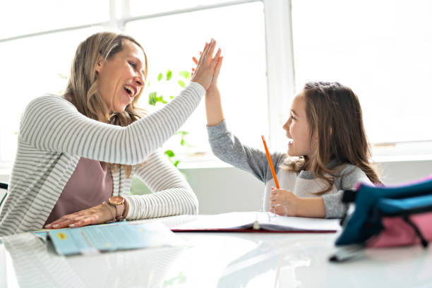istock A Mother and Child doing homework at home 1081926394