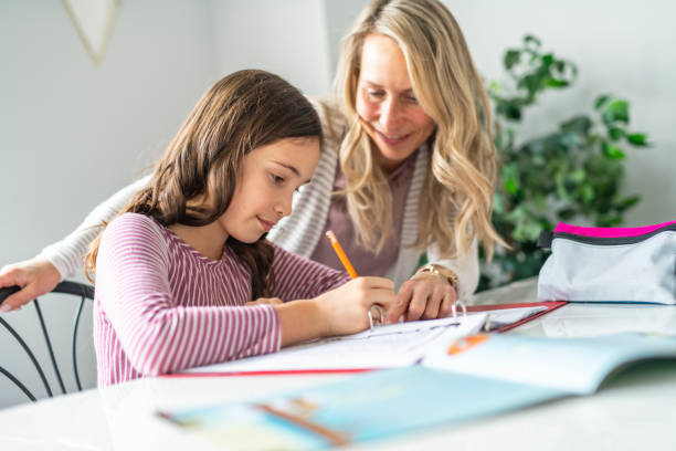 istock A Mother and Child doing homework at home 1081926460