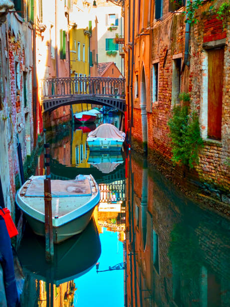 istock Shady canal with bridge in Veinice 1081926722