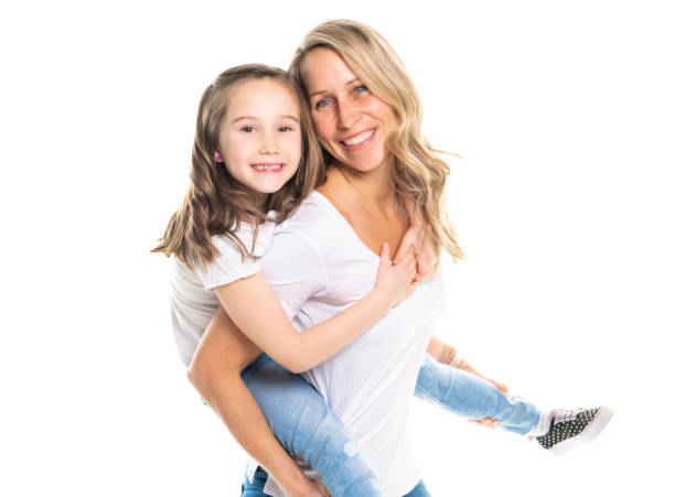 istock A mother and daughter portrait isolated on white studio. 1081927150