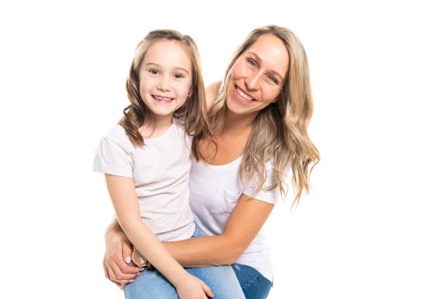 istock A mother and daughter portrait isolated on white studio. 1081927156