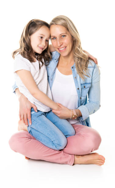 istock A mother and daughter portrait isolated on white studio. 1081928356