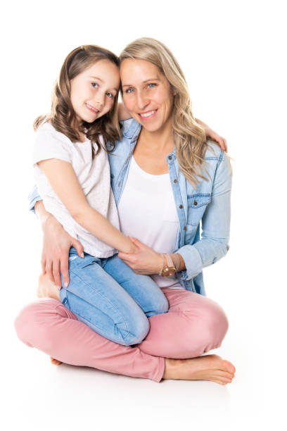 istock A mother and daughter portrait isolated on white studio. 1081928368