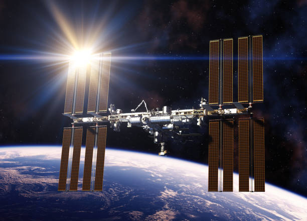 Reflecting Sun In Solar Panels Of International Space Station Reflecting Sun In Solar Panels Of International Space Station. 3D Illustration. international space station stock pictures, royalty-free photos & images