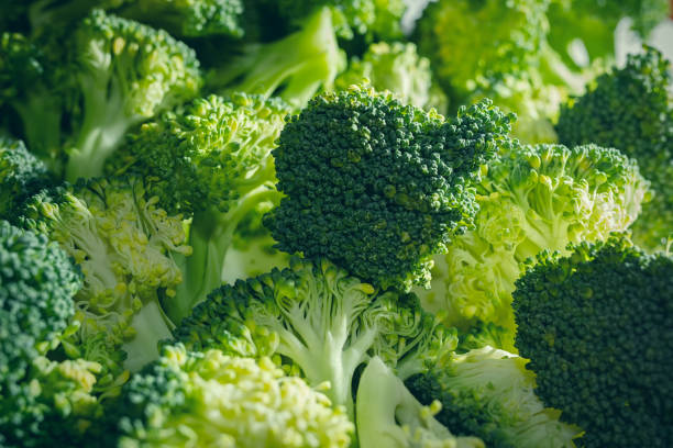 istock Bunch of fresh broccoli florets in the morning light 1081943282