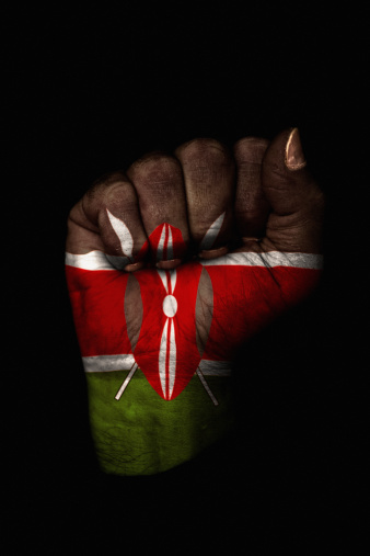 Image of a dirty clenched fist with the flag of Kenya painted on it.