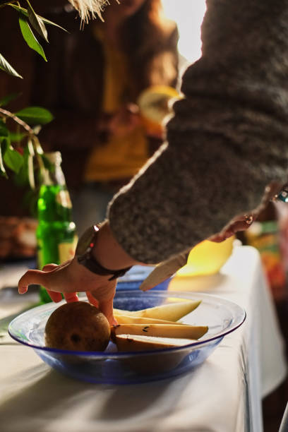woman cooking with pear at home kitchen