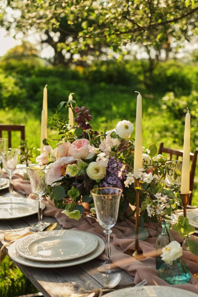 istock Wedding dinner in the garden. Wedding Banquet in the park. table setting 1081947646