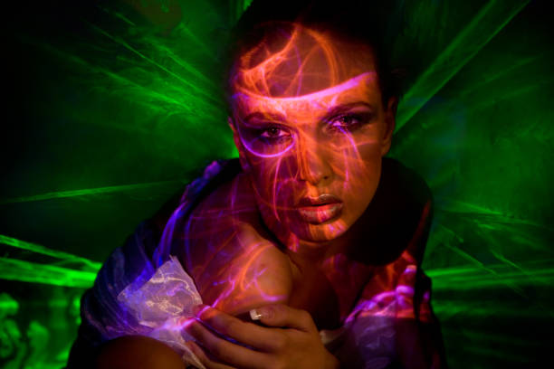 istock Young Woman with Laser Lights All Over 108194885