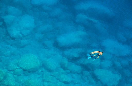 Couple snorkeling in wonderful turquoise water - Mediterranean Sea, Greece

See also
[url=http://www.istockphoto.com/file_closeup_edit.php?id=5333864&refnum=aprott][img]http://www.istockphoto.com/file_thumbview_approve.php?size=1&id=5333864[/img][/url]