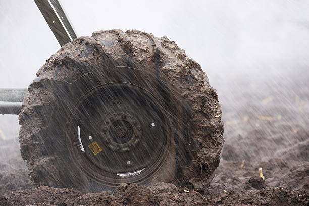 Muddy Tire Agriculture Irrigation Sprinkler stock photo