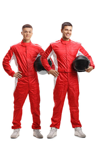 istock Two young racers standing and holding helmets 1081951312