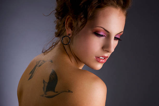 istock Beautiful Young Woman with Tattoos and Make Up, Copy Space 108195246