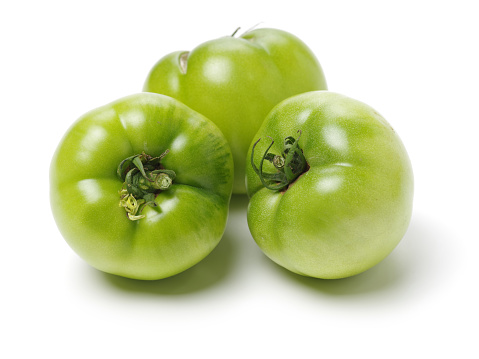 Green ripe tomatoes   on white background