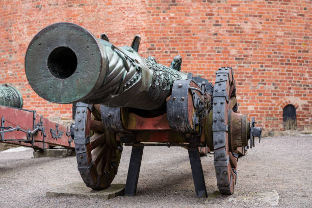 istock Old brass canon on wooden wheels 1081953838