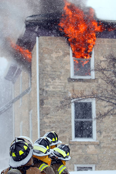 istock Firefighters at House Fire During Snow Storm 108195387