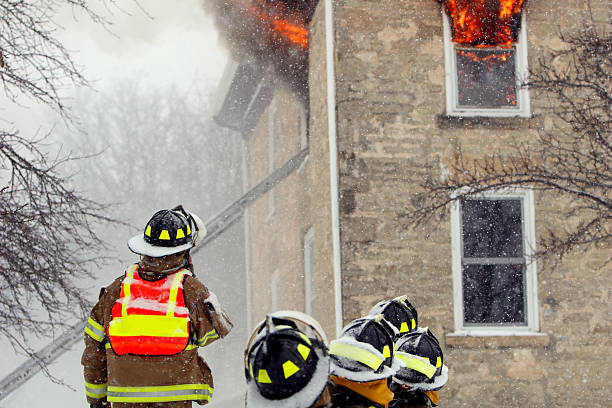 istock Firefighters at House Fire During Snow Storm 108195388
