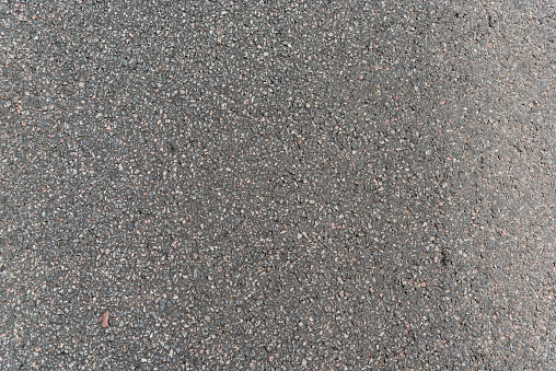 Asphalt road texture,  Grainy background,small chopped stones black, white and gray