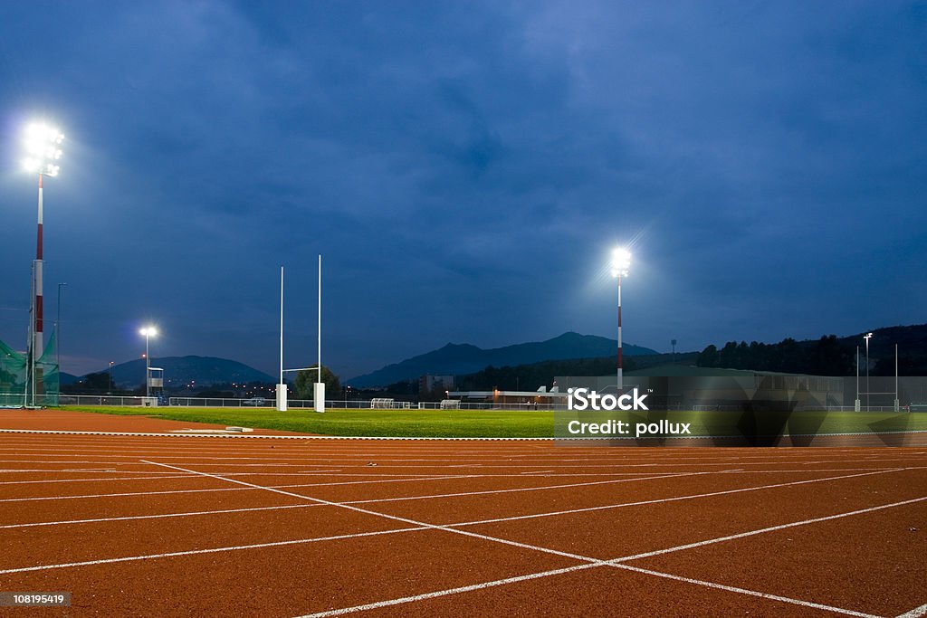 Track and Field Stadium at Night  No People Stock Photo
