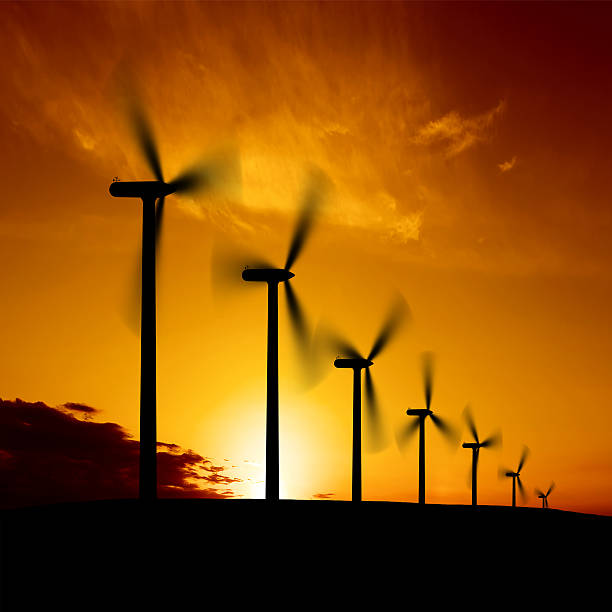 xxl wind farm atardecer - wind turbine motion alternative energy wind power fotografías e imágenes de stock