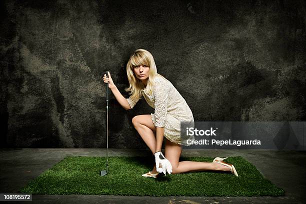 Young Woman Posing On Turf Grass With Golf Club Stock Photo - Download Image Now - Golf, One Woman Only, Bizarre