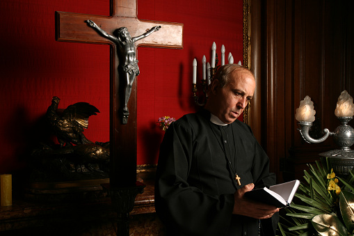 Priest reading inside funeral