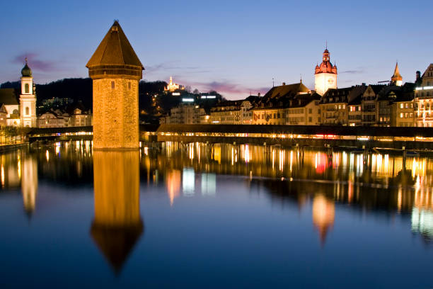 istock Lucerne City Skyline, Chapel Bridge Reflected on Water at Dusk 108195860