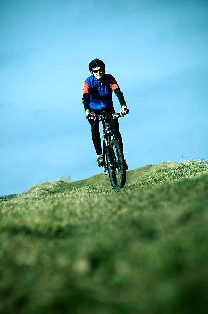 istock Young Man Mountain Biking in Field 108195923