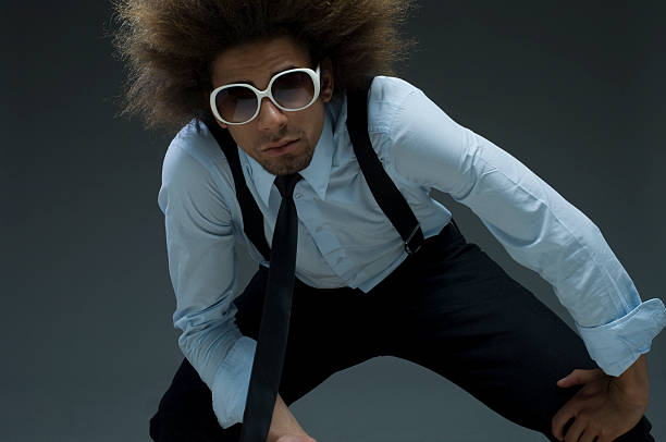 Studio shot of young handsome businessman wearing eyeglasses horizontal shot