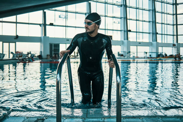 istock swimmer getting out of the water 1081959976