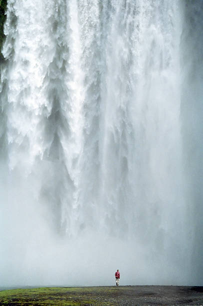 istock Man walking at the Skogafoss, Iceland 108196008